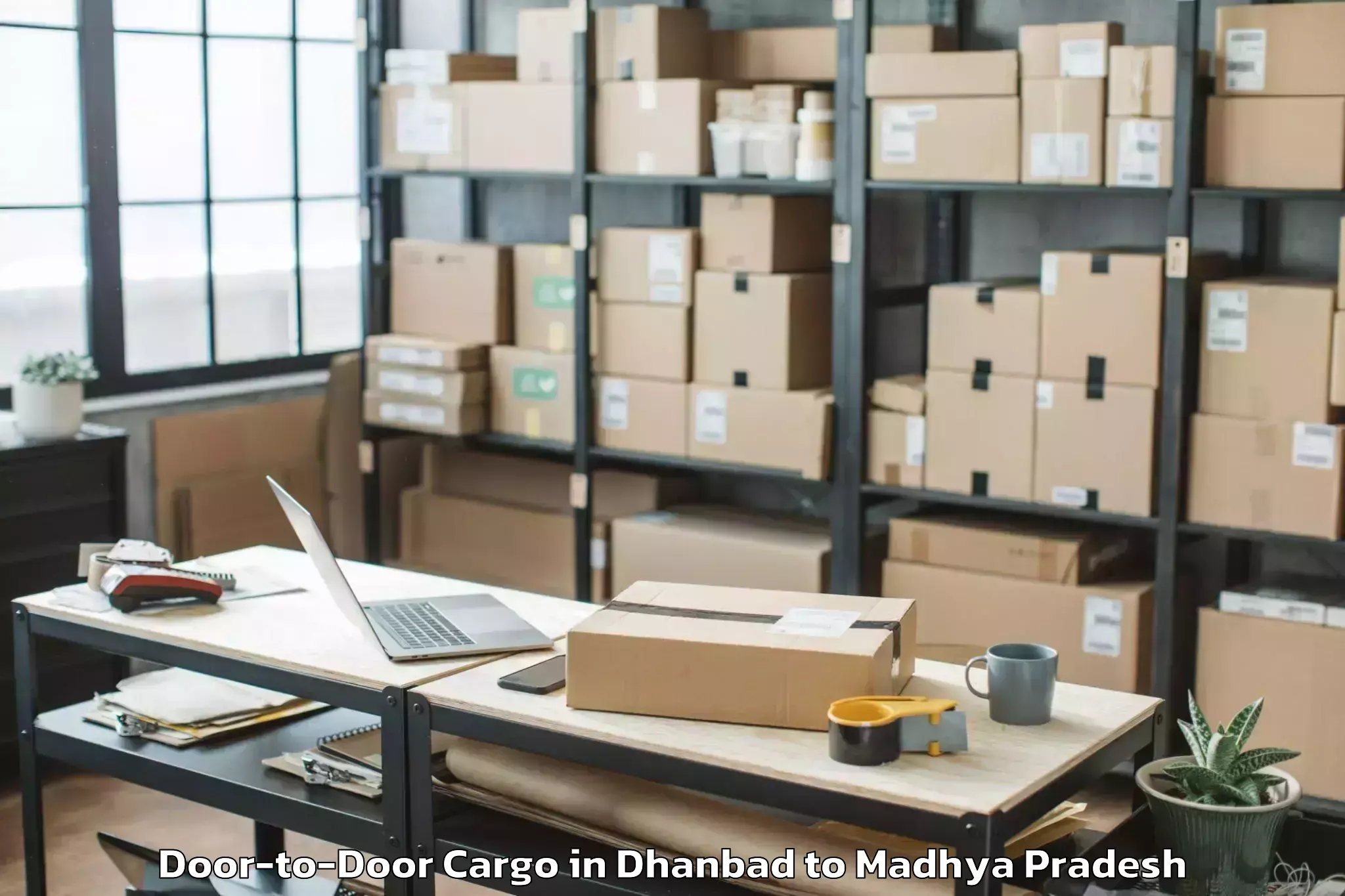 Quality Dhanbad to Agar Door To Door Cargo